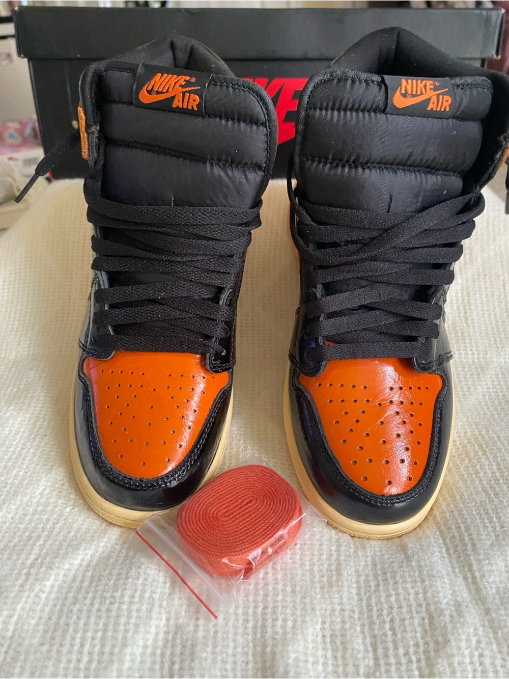 Nike Women’s Black and Orange High-Top Sneakers